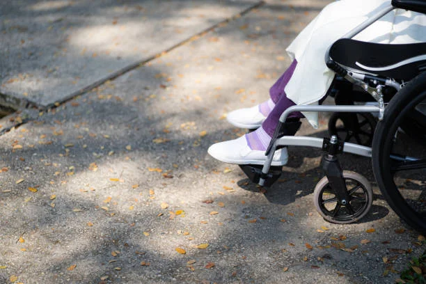 Child using a Circle Specialty adaptive stroller outside